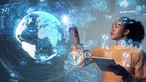 A young woman traces the outline of a globe as she shows how to create a data collection plan.