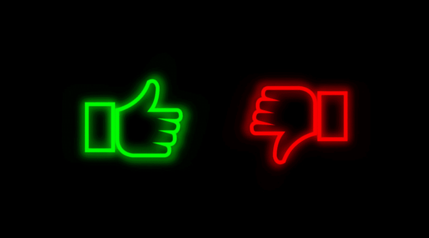 neon sign with green thumbs up and red thumbs down